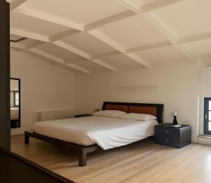 Postel nebo postele na pokoji v ubytování La Manovella Apartment