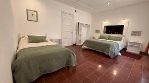 En eller flere senge i et værelse på Hostería Viñas de Uquia + 6 billeder