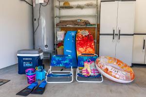 a room with a bunch of toys and other items at Marbella Lane - Elegant 3BR w Marvelous Views in Waianae