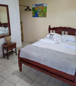 Postel nebo postele na pokoji v ubytování Chale's House Hotel