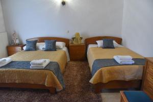 Ένα ή περισσότερα κρεβάτια σε δωμάτιο στο Goura Grand View House