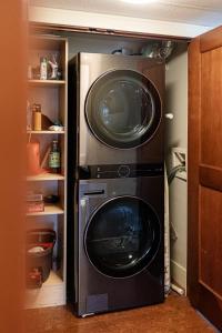 a washer and dryer in a small kitchen at Misty Mountain- Premium 2 Bedroom Mountain View in Canmore