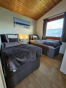 En eller flere senge i et værelse på Ferienhaus Küstenzauber Simonsberg Nordsee Meer Husum