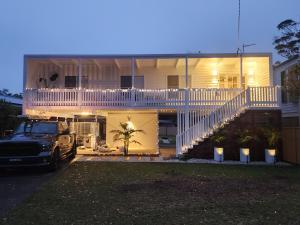 a truck parked in front of a house at night at Beach Bound-Jervis Bay in Vincentia