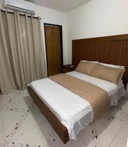 En eller flere senge i et værelse på Casa Vacanza apartamento 4