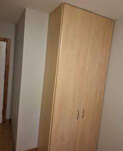 a wooden cabinet in the corner of a room at holiday in Waterford