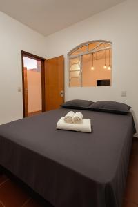 En eller flere senge i et værelse på Studio a 4 min Centro, 5 min UFU e Hospital Sta Marta