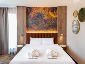 Una cama o camas en una habitación de Mercure Bialystok