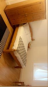a bunk bed in a room with a wooden ceiling at Cozy & Comfy Apartments Dundee in Dundee