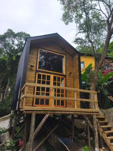 En have udenfor Chalé Lagarto com Praia da Solidão em meio a natureza, Florianópolis