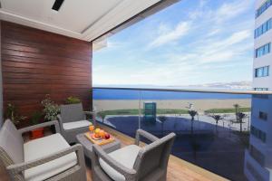 a balcony with a view of the ocean at Luxury Sea View À 2 pas de la Marina in Tangier