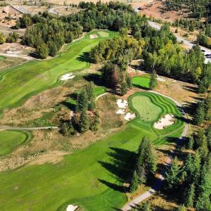 an overhead view of a golf course with trees at SilverStrike Condos Family Friendly Walkable Location Unit 2 in Kellogg