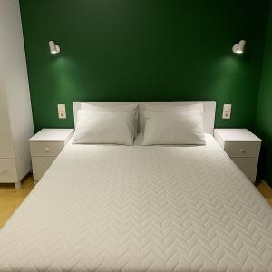 Postel nebo postele na pokoji v ubytování Old Batumi Stay