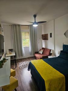 En eller flere senge i et værelse på BELO flat Cavalinho Branco-Aguas de Lindóia + 35 billeder