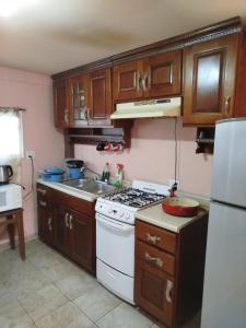 O bucătărie sau chicinetă la Hospedaje Barato Mi Casita de Colores