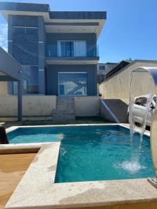 Hồ bơi trong/gần Casa em Guarapari