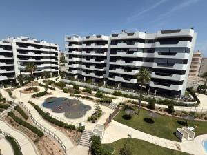 an aerial view of two large buildings and a park at Arenales SLB in Arenales del Sol