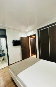 Ένα ή περισσότερα κρεβάτια σε δωμάτιο στο founty Rsidence agadir bay1