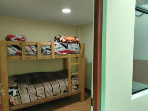 Postel nebo postele na pokoji v ubytování House for Adventurers, Sol de Paracas