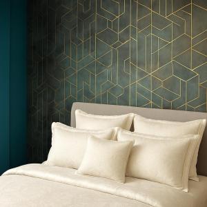 a bed with white pillows and a green wall at Bright 1-Bedroom Apartment Milton Keynes in Milton Keynes