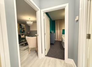 an open door to a room with a bedroom at Bright 1-Bedroom Apartment Milton Keynes in Milton Keynes +4 photos