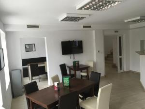 A television and/or entertainment centre at By The River Hotel