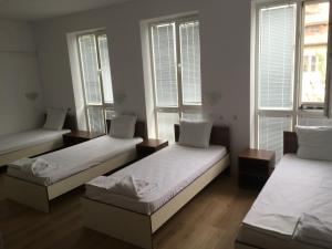 A bed or beds in a room at By The River Hotel