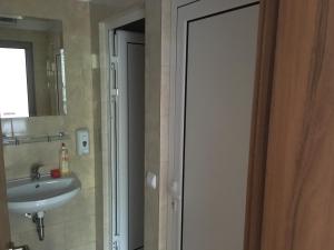 A bathroom at By The River Hotel