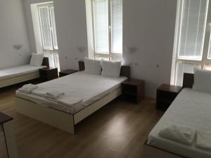 A bed or beds in a room at By The River Hotel
