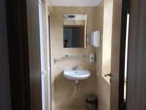 A bathroom at By The River Hotel