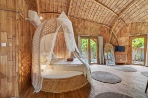 TV a/nebo společenská místnost v ubytování Noon Bamboo Villas Pererenan