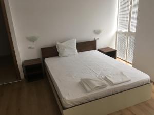 A bed or beds in a room at By The River Hotel