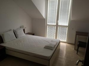 A bed or beds in a room at By The River Hotel