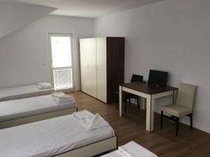 A bed or beds in a room at By The River Hotel