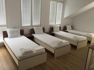 A bed or beds in a room at By The River Hotel