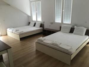 A bed or beds in a room at By The River Hotel