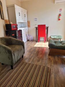 Posezení v ubytování Cocoplum Rest N Hideaway #1 + 12 fotografií