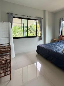 Ένα ή περισσότερα κρεβάτια σε δωμάτιο στο Chon Nara Place 2