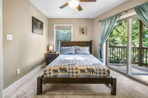 a bedroom with a bed and a window at Distiller's Den in Gatlinburg