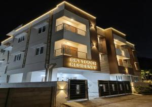 a building with a sign that reads sky provider residency at Skytouch Residency-OMR in Chennai
