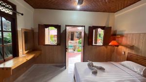 Ένα ή περισσότερα κρεβάτια σε δωμάτιο στο Gusti Home Stay Ubud +85 φωτογραφίες