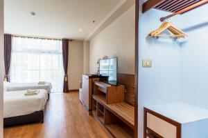 Ένα ή περισσότερα κρεβάτια σε δωμάτιο στο Mahachai Grand View