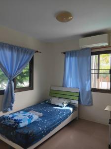 Postel nebo postele na pokoji v ubytování Backpack Bay