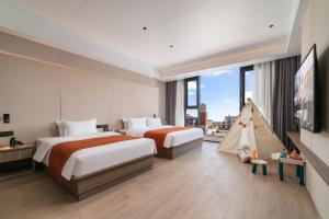 En eller flere senge i et værelse på Ruiyue Resort Hotel (Shenzhou Peninsula Branch)