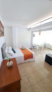 Кровать или кровати в номере Residencia playa Punta Veleros