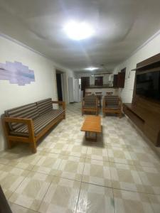 Et opholdsområde på SM Homestay - Casa Jacumã