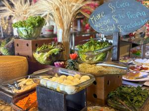 a display of vegetables and other food on a table at LXHotel Condomar in Puerto Vallarta