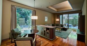 a living room with a couch and a table at Fufu Atami in Atami