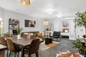 a living room with a table and a couch at Luxe Logan Circle Escape - Near Downtown DC & Shaw in Washington