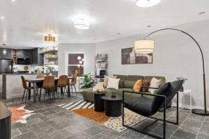 a living room with a couch and a table at Luxe Logan Circle Escape - Near Downtown DC & Shaw in Washington